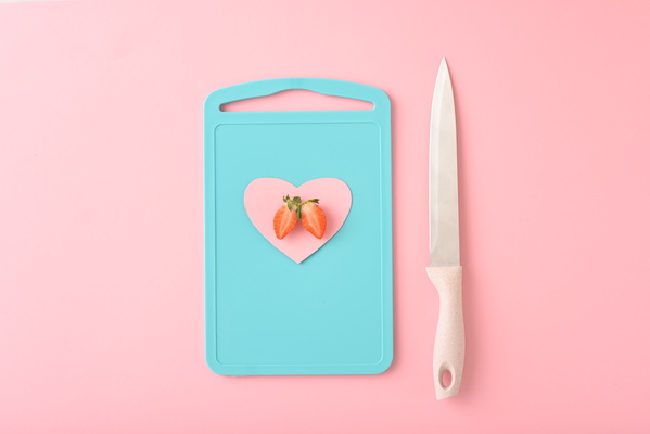 Cutting Board with Knife and Valentine Card and Strawberry
